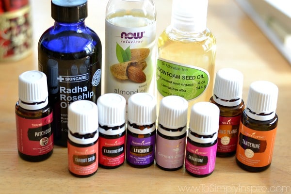 several bottles of essential oil with other bottles of oil