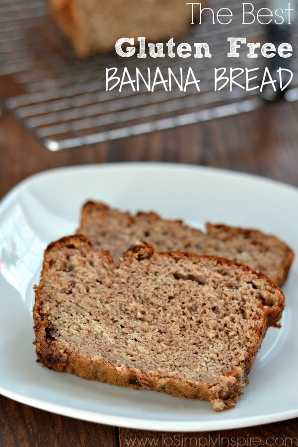 closeup of two slices of banana bread on white plate with a wire rack in background 