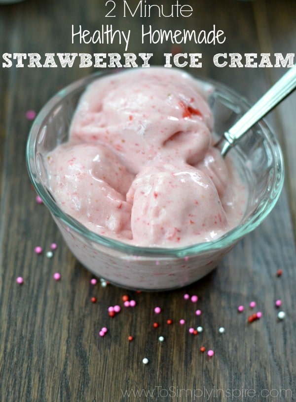 closeup of 2 ingredient Homemade Strawberry Ice Cream in a glass bowl with silver spoon and with text overlay
