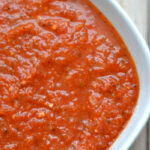 closeup of homemade marinara sauce in white bowl