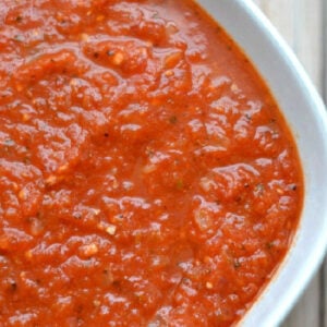 closeup of homemade marinara sauce in white bowl