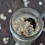 a mason jar with oatmeal and a spoon