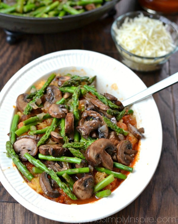 Spaghetti Squash Primavera recipe with asparagus and mushrooms in a white bowl 