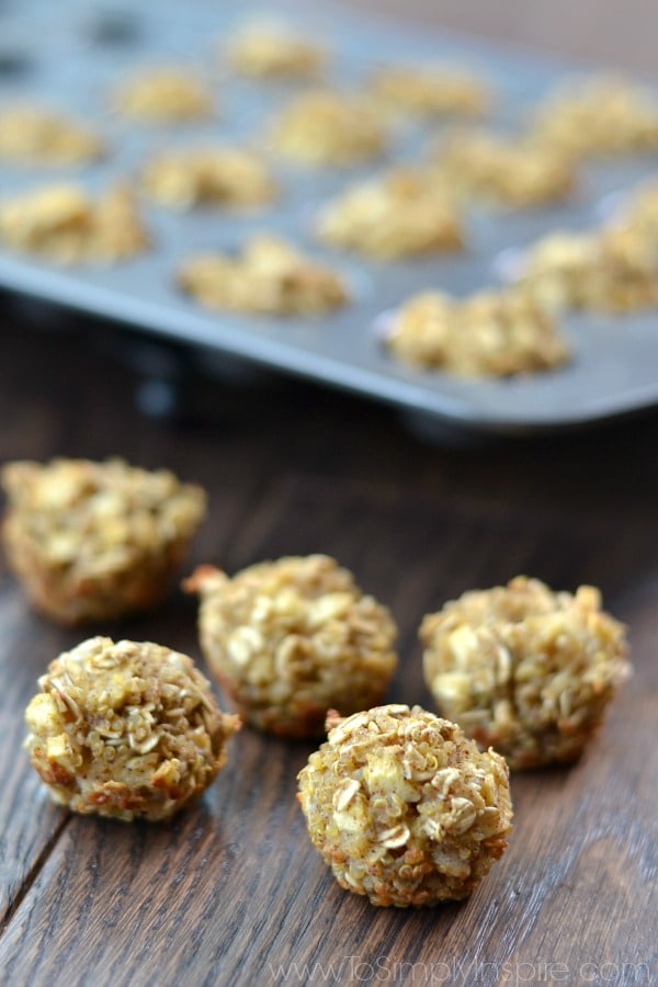 A close up of Cinnamon Quinoa bites on a table with a muffin tin 