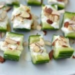 cucumber slices with feta and almond slices