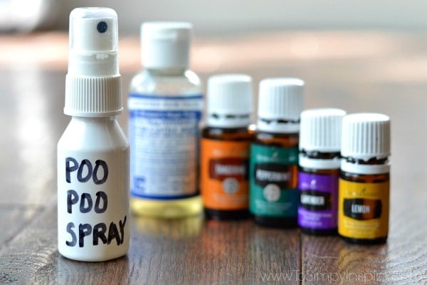 5 essential oils in bottles with a small bottle of castille soap