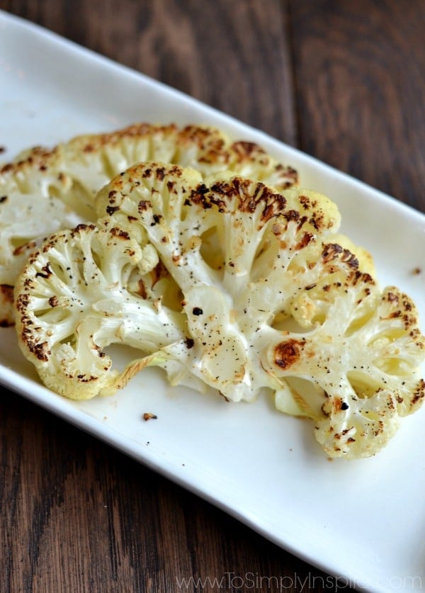 A white plate with two Cauliflower Steaks