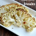 A white plate with two Cauliflower Steaks