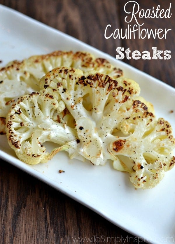 A white plate with two Cauliflower Steaks