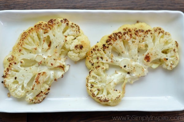 A white plate with two Cauliflower Steaks