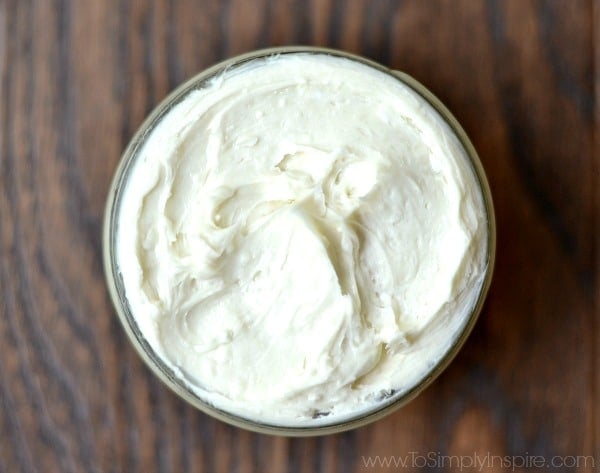 A close up of a bowl of whipped homemade lotion