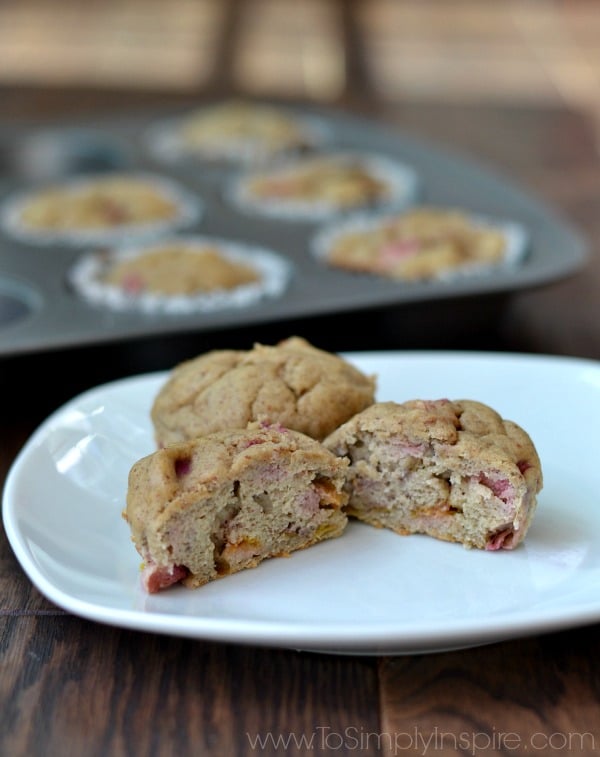 two banana rhubarb muffins on a white plate