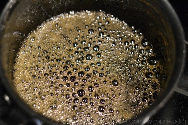 Honey boiling in a black pot