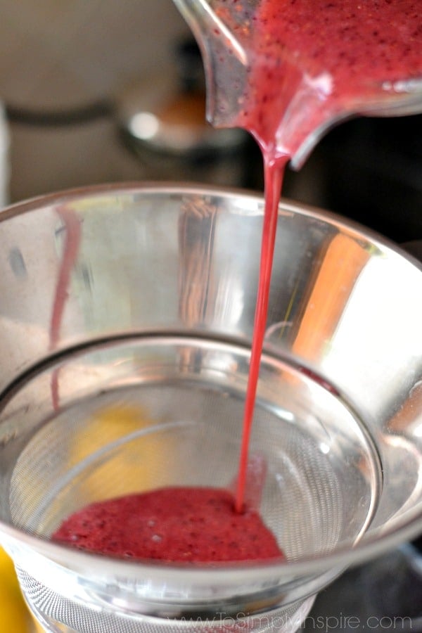 pouring red liquid through a strainer