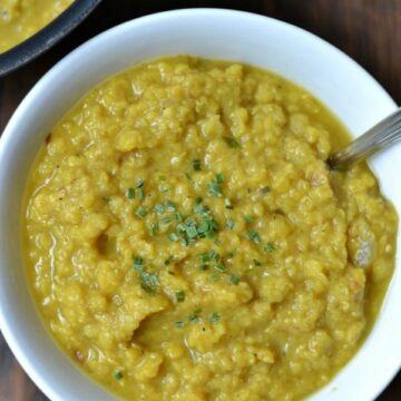 A white bowl of red lentil stew
