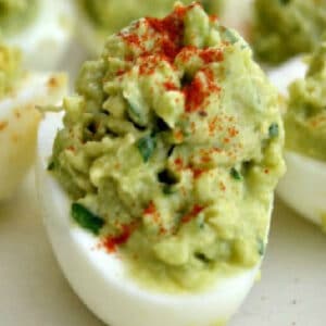 closeup of deviled egg made with avocado instead of mayo