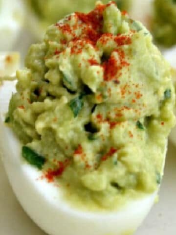 closeup of deviled egg made with avocado instead of mayo