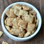 muddy buddy cereal snack in a white bowl