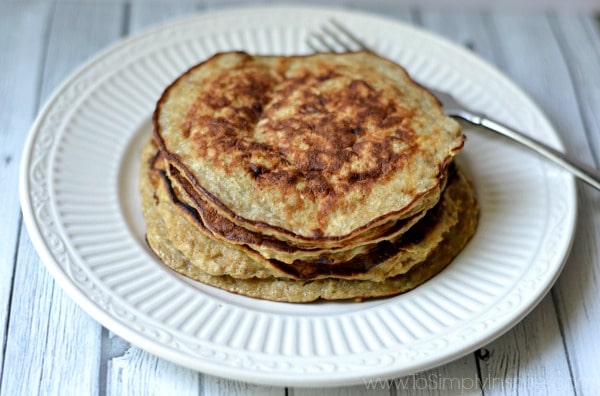 Five Banana Pancakes stack on a white plate with a fork.