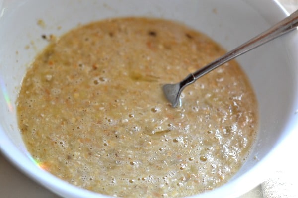 Flourless Banana Pancakes batter in a white bowl with a fork