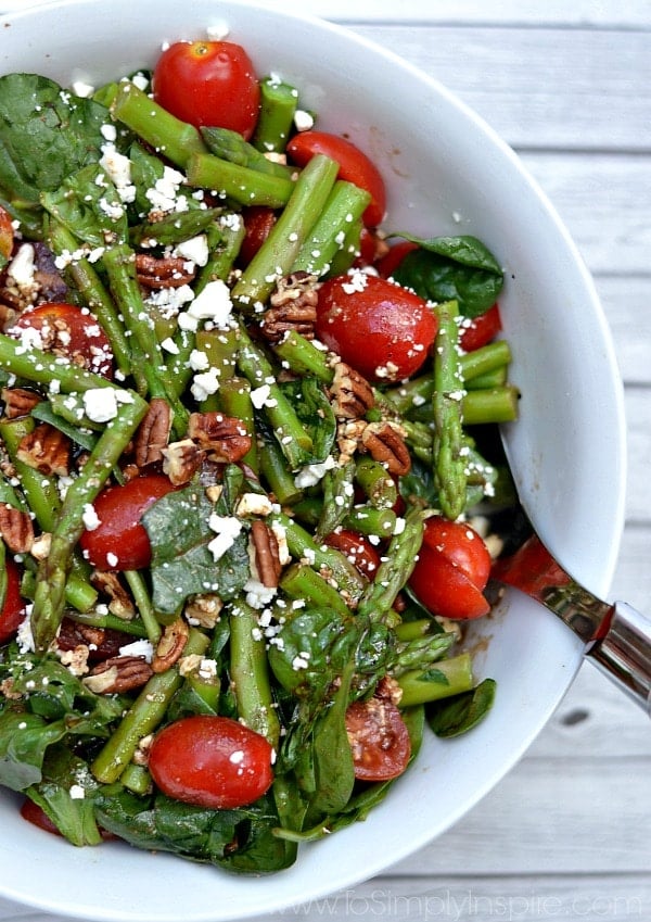 closeup of a salad with asparagus and tomatoes