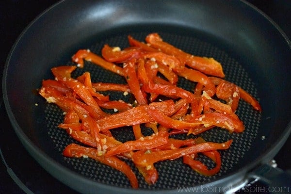 A pan filled with red pepper slices