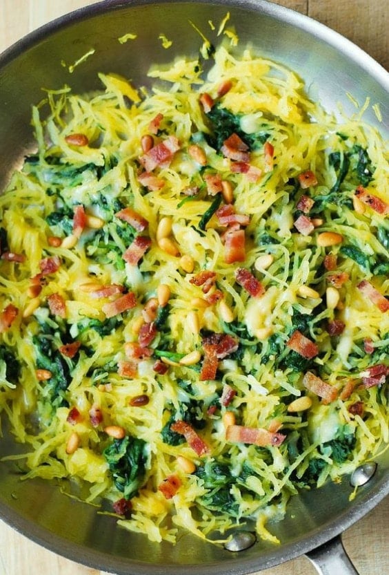 spaghetti squash mixed with spinach, bacon and pine nuts