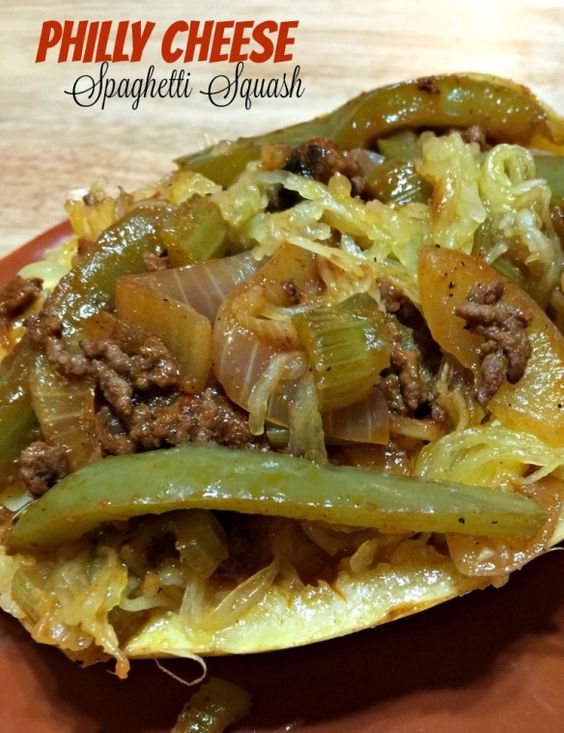 spaghetti squash half with green peppers and onions