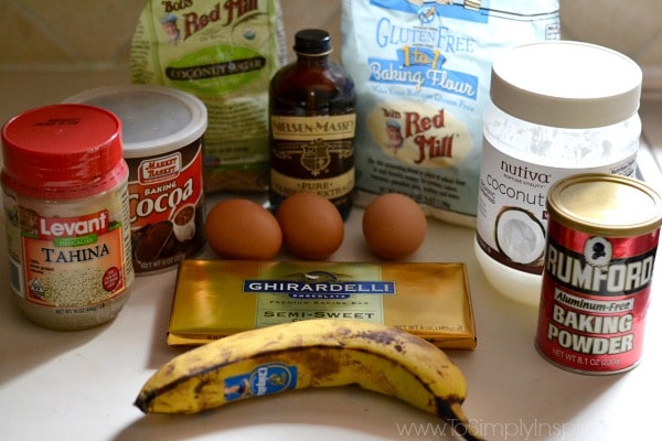 A banana, three brown eggs, cocoa powder, four, chocolate bar