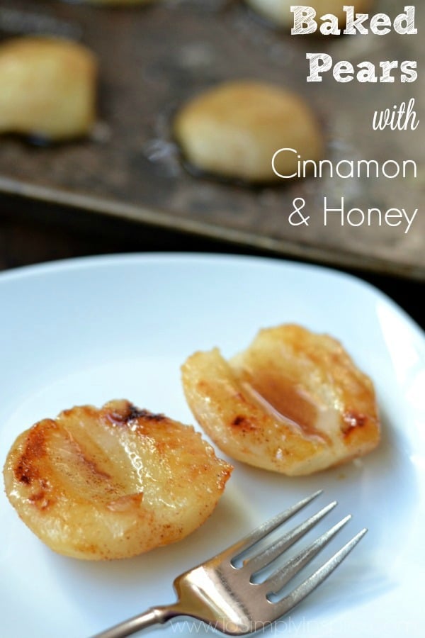 Simple Baked Pears with Cinnamon and Honey are a wonderful healthy snack or turned into a luscious dessert when topped with a dab of vanilla ice cream. two baked pears on a white plate with a fork