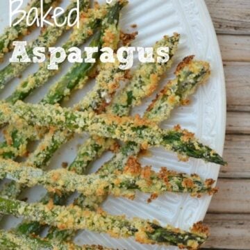 asparagus coated in panko breadcrumbs on a white plate