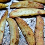 A pile of fries on a baking sheet