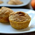 two pumpkin muffins on a white plate