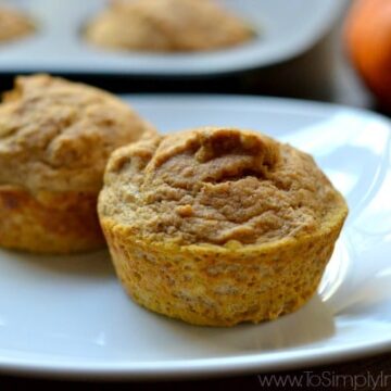 two pumpkin muffins on a white plate