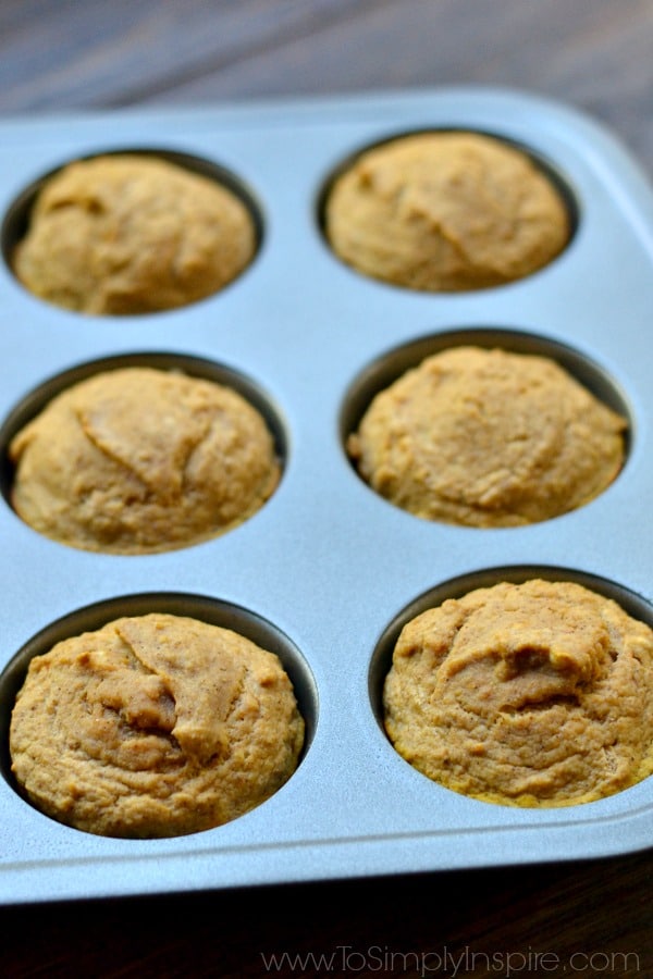 6 pumpkin muffins in a muffin tin