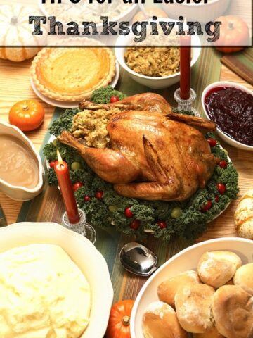 A thanksgiving turkey on a table surrounded by different side dishes