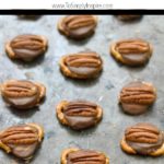 Rolo Pretzel Turtles on a baking sheet with text overlay