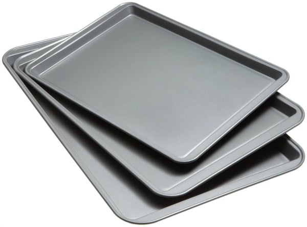 a set of three metal baking sheets