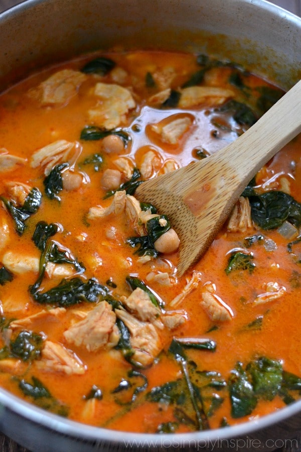 This Curry Chicken and Chickpeas is wonderfully scrumptious and so simple to prepare. Serve this restaurant quality dish over rice and it will be raved over for days. A close up of soup with Chickpeas, spinach and Chicken