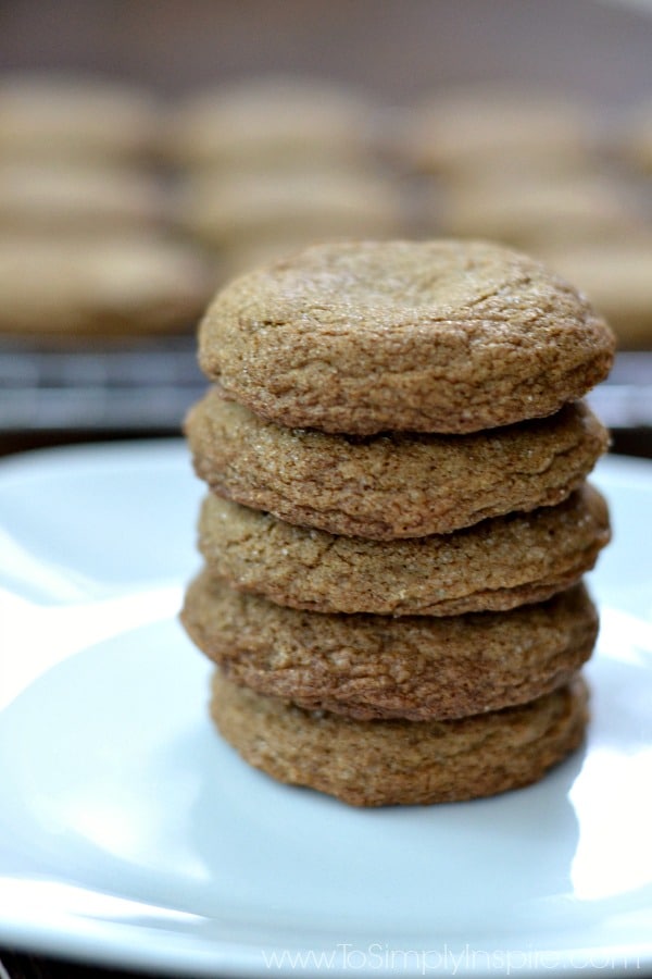 Crispy on the outside and soft on the inside, these Molasses cookies will literally melt in your mouth. They are a wonderful spiced cookie to add to your family favorites and holiday baking. A stack of 5 molasses cookies on a white plate