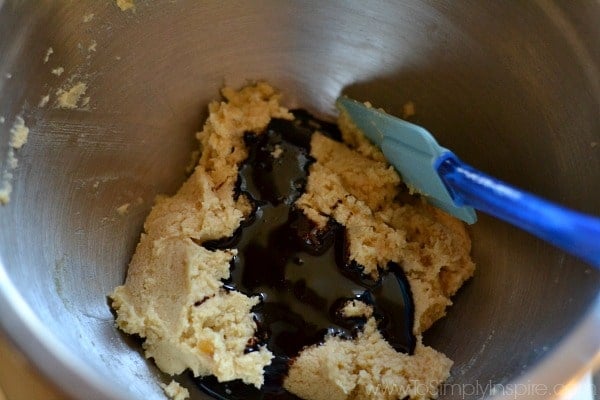 mixing bowl with cookie dough and molasses on top