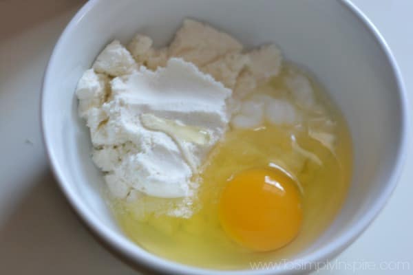 egg yolk and protein powder in a white bowl