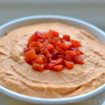 closeup of Roasted Red Pepper hummus recipe in a white bowl