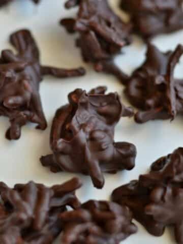 a group of Chocolate Haystacks recipe on a white plate.