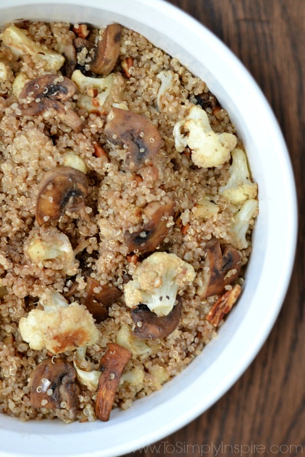 Quinoa, cauliflower and mushrooms in a white bowl