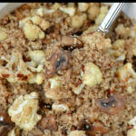 closeup of quinoa with cauliflower and mushrooms in a bowl