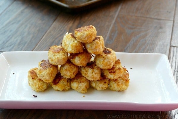 Cauliflower Tots recipe stacked on a white plate