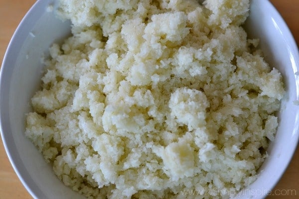 Overhead shot of Riced Cauliflower in a white bowl
