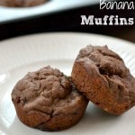 Two chocolate banana muffins on a white plate