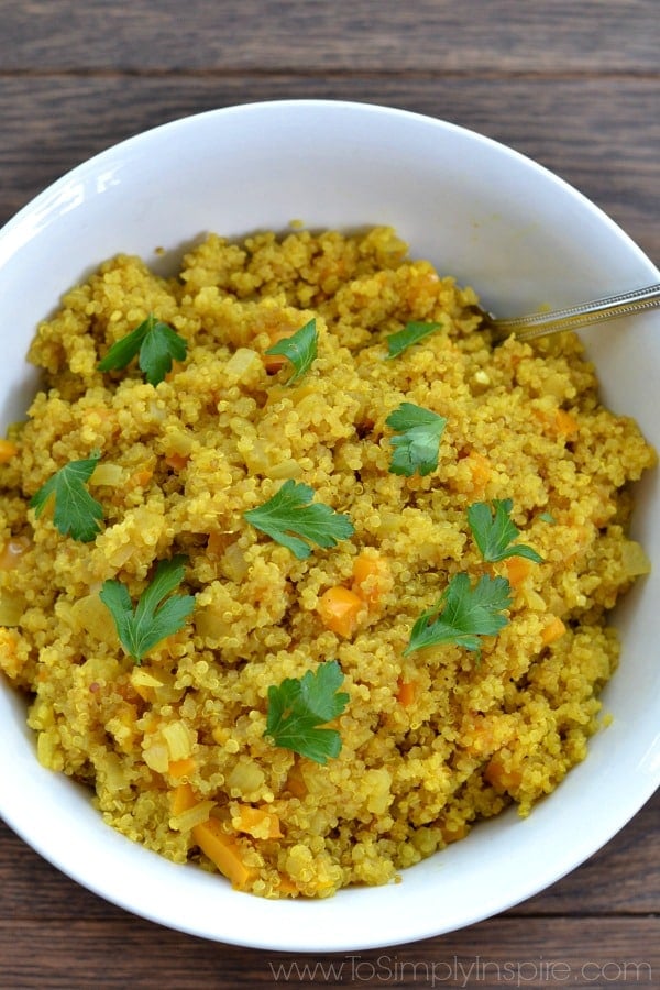 Curried Quinoa recipe in a white bowl topped with cilantro